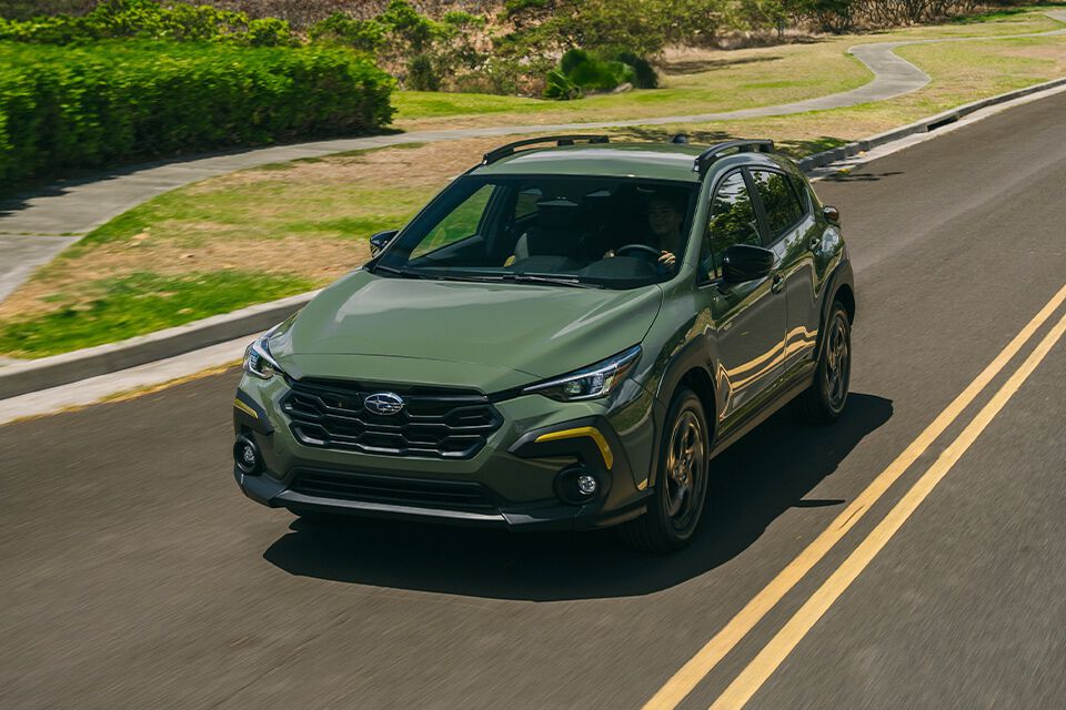 Alpine Green 2024 Crosstrek driving on road